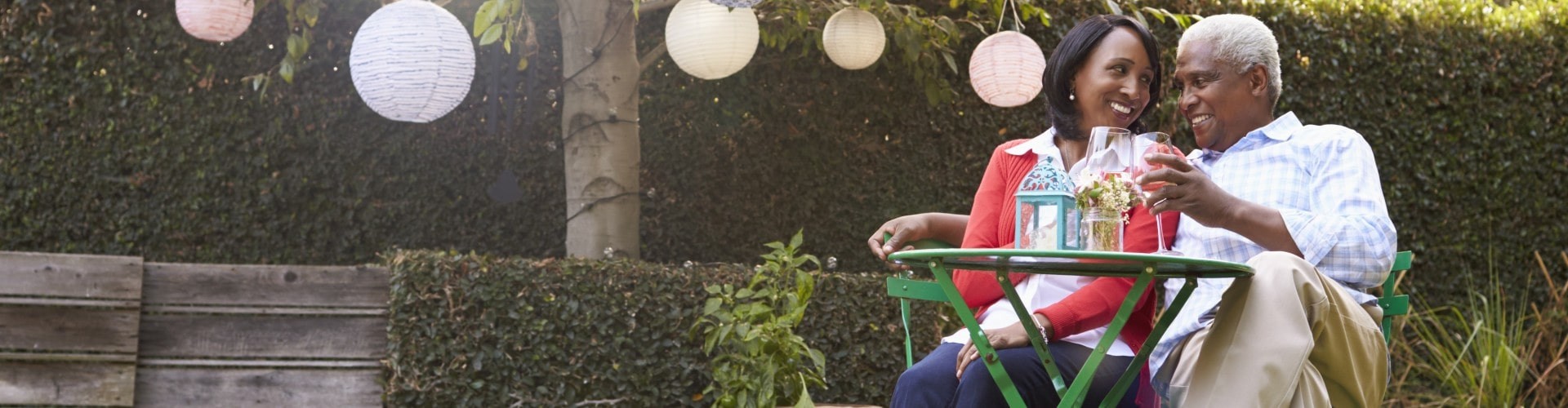 senior couple drinking a beverage on their patio