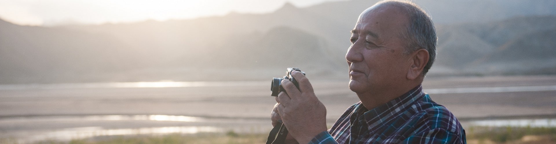 senior man taking a photo