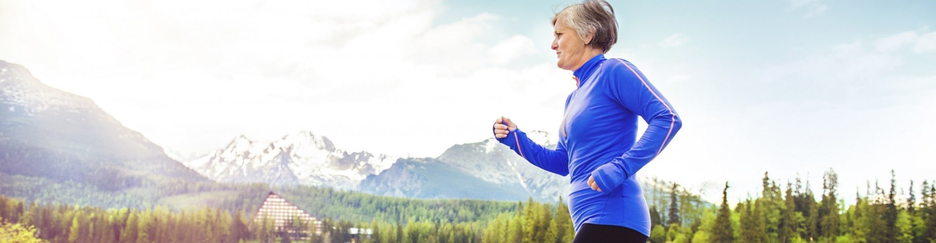 senior woman running in the beautiful outdoors